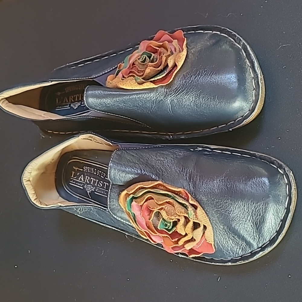 Size 39..european..all leather uppers..slip on..never worn. Lartiste